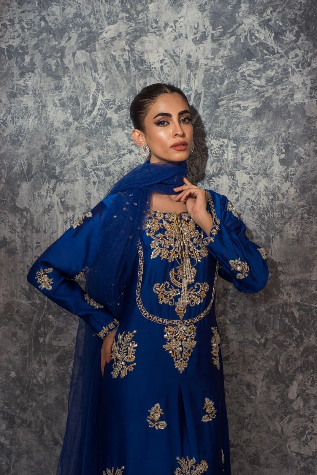 Royal Blue pakistani fashion outfit in gold, blue tones.